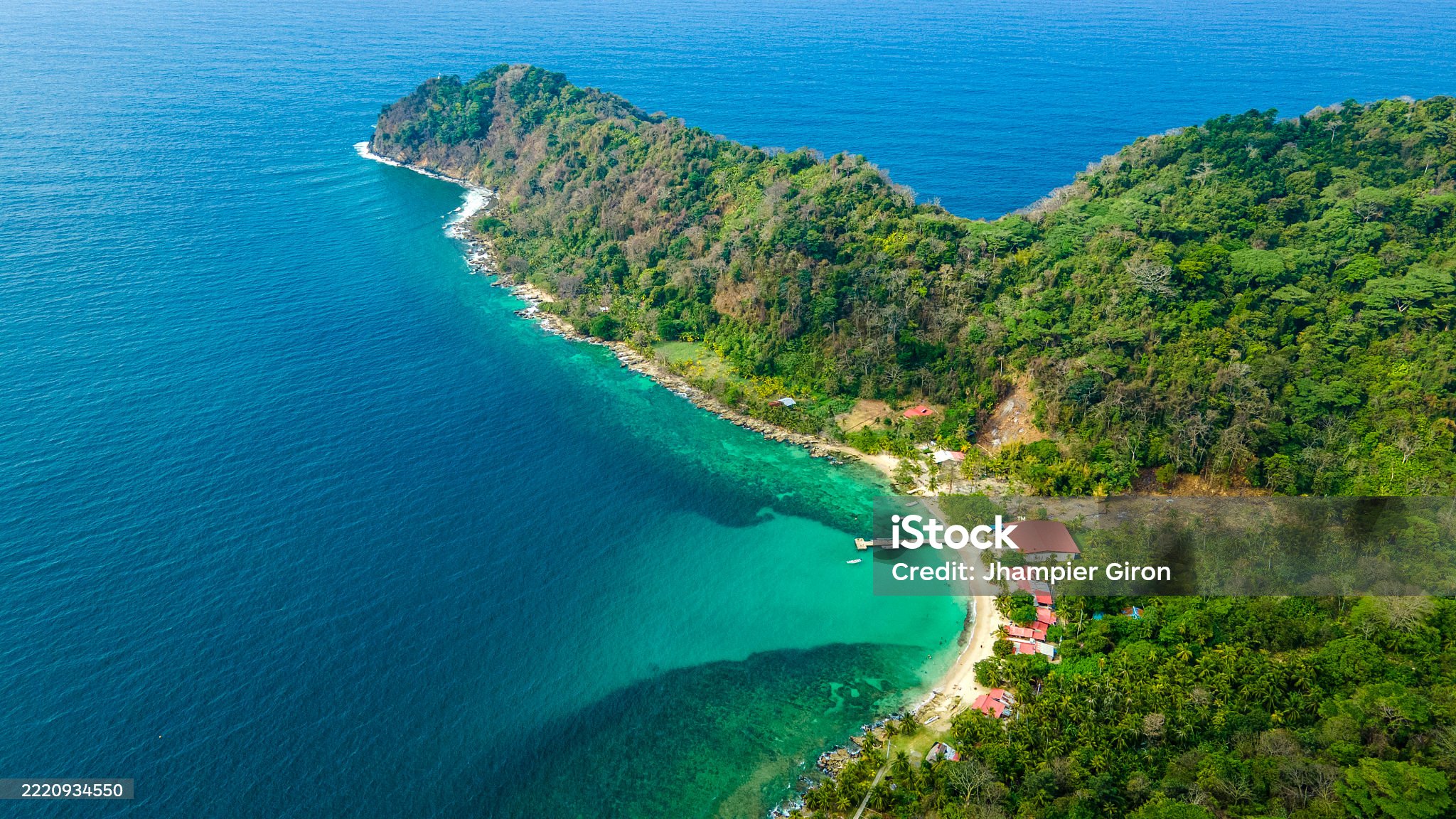Stunning aerial view of Tolu beach in Sucre, Colombia, featuring lush greenery and clear turquoise waters, ideal for tourism and vacations.